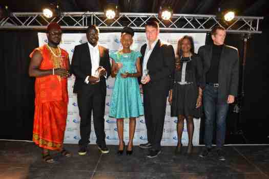 Odimegwu Onwumere in a group picture with other recipients and two of the judges