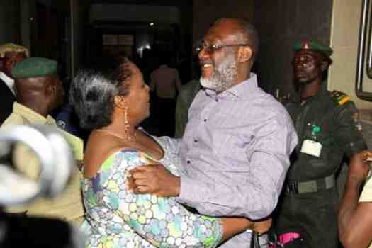 Olisa Metuh hugging wife dduring his court trial